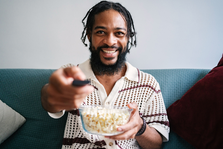 Young man in personal perspective watching TV